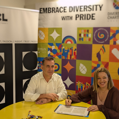 Helen Alexiou signing the Diversity Charter